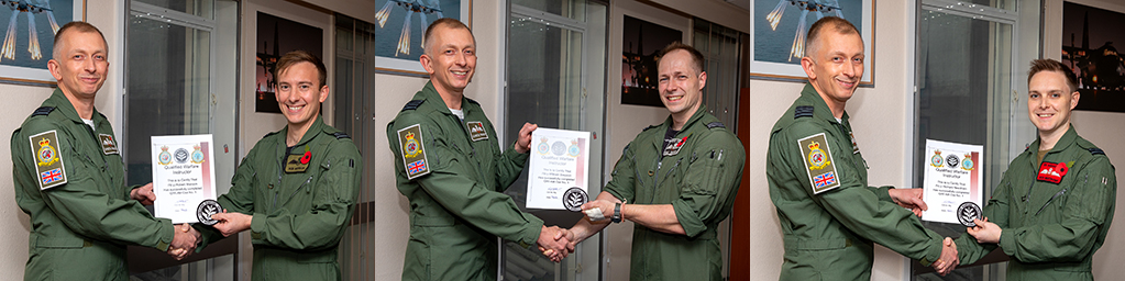 Group Captain Gareth Burdett Commander Air Wing presents certificates to graduates